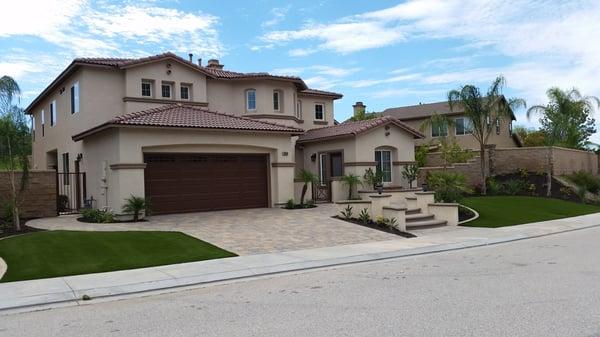 Beautiful yard transformation by waterwise, entry and driveway pavers, artificial turf, drought tolerant landscape!!!