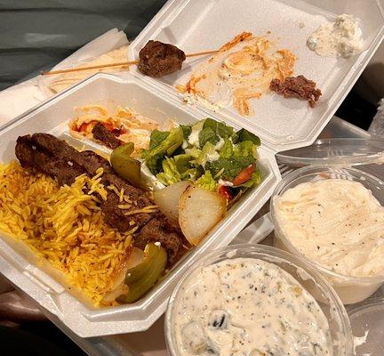 Filet Skewer plate (2 skewers, rice, salad, hummus and pita with a la cart Vegetable Skewer, with Garlic Sauce/Paste and Tzatziki.