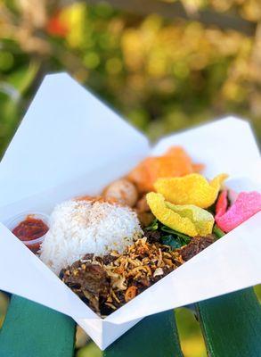 Beef Rendang Rice Platter w/ curry jackfruit, sautéed greens, egg, rice, crackers | $14