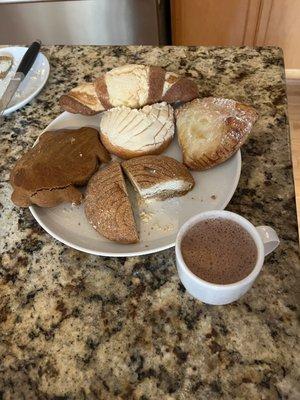 Mexican hot chocolate, conchas, dulce de leche empanada and a marranito.