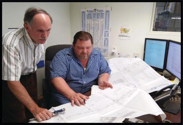 L-R David Hawley Engineer and owner , Michael Moore, Plant Manager consider customer requirements.