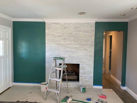 Refreshed fireplace with stacked stone and paint