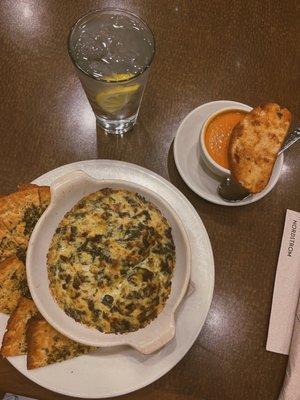 artichoke spinach dip and a cup of roma tomato basil soup