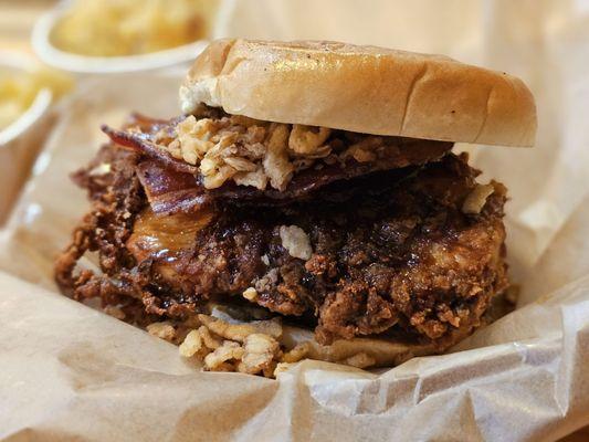 Dirty Bird sandwhich: Crispy Chicken Breast w/honey bbq sauce, double smoked bacon, crispy onion straws, pickles & chipotle ranch. A