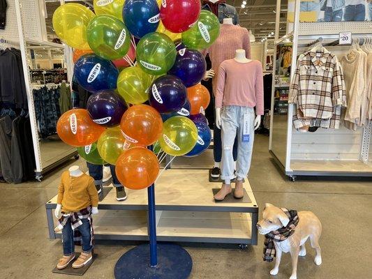 Cutely dressed headless mannequin family display upon entering. At least the dog has a head. Haha.