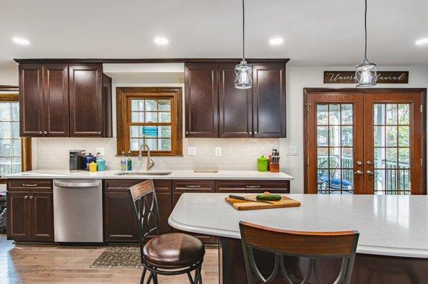 Kitchen remodeling in Burke, VA with gleaming backsplash tiles & wooden cabinets