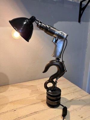 Industrial lighting and small furniture pieces available at the Pagio Gallery.