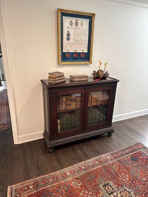 Bookcase once used as an entertainment cabinet, now again a bookcase.