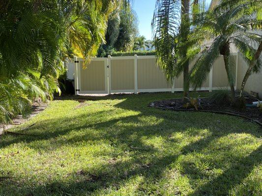 looking from the front yard to the new fence around the back yard.  Large gate that is extremely strong but easy to open & close.