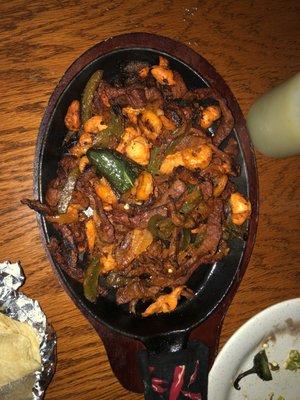 Steak, chicken, and shrimp fajitas.  We nibbled a little  bit before I took the pic.