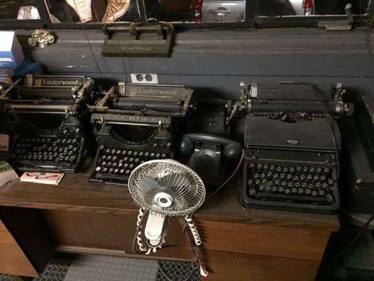 A collection of old typewriters. Why they're here, I don't know.