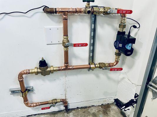 Pressure reducing valve installed on main water line with an automatic leak detection shut off device required for farmers insurance policy.