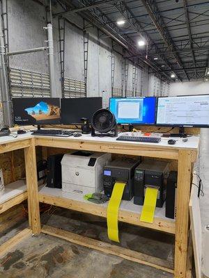 Receiving area for cargo. PCs and label printers connected to Magaya.