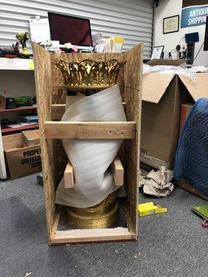 Crating a pair of bronze statues.