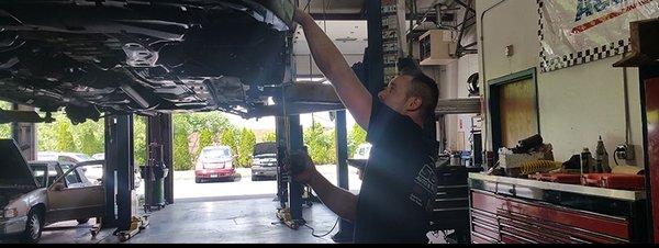 Our team performing auto repair service