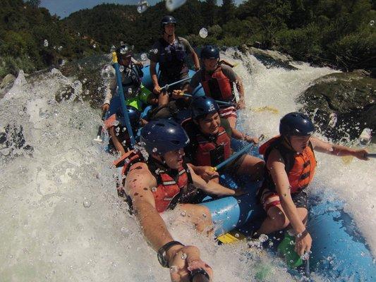 Selfie Stick perspective of whitewater rafting