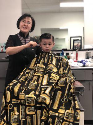 My son and his barber, Sun. She was great with him and gave him an awesome cut.