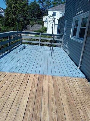 Sanded deck being stained