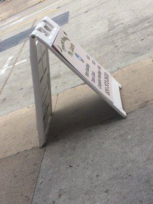 Horribly angled picture of Ms. Laurie's sign from inside her waiting area