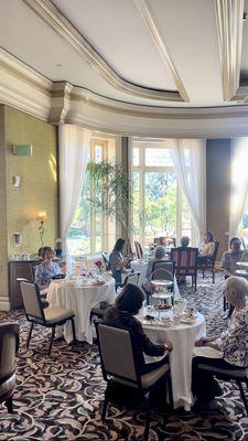 The Langham tea room's dining room (my mother is sitting at our table, on the far left of the photo).