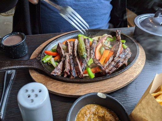 Beef fajitas.  Came with small pot of rice and tiny pot of beans or something like that.