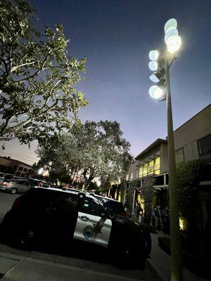 Parking lot was lit up with bright lights.