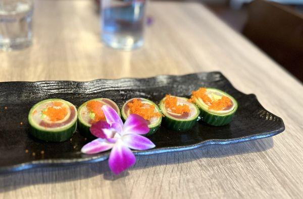 Green Garden Roll: cucumber wrap w/ salmon, tuna, hamachi, avocado, crabmeat