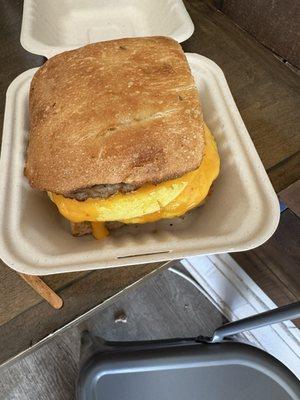 Breakfast sandwich with egg, sausage and cheese.  Yum!