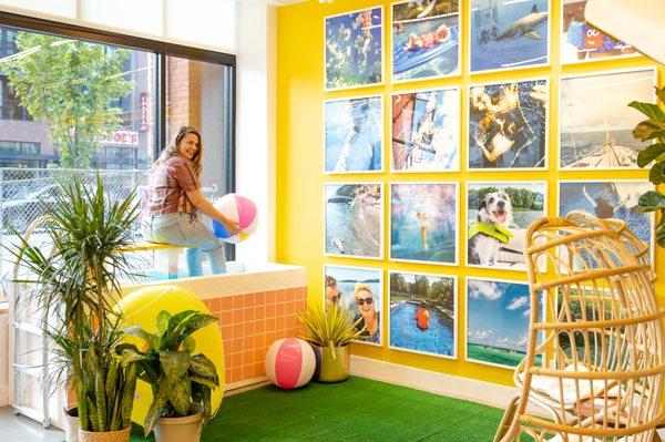 Framebridge's summer gallery wall which includes a display swimming pool