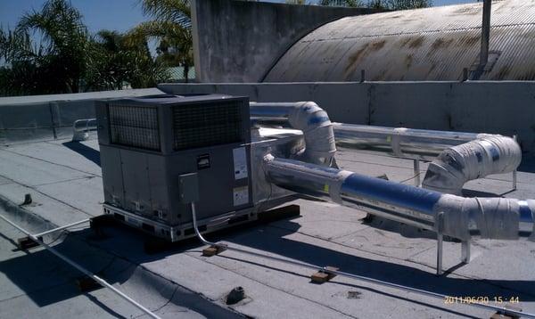 Package unit and duct work on roof.