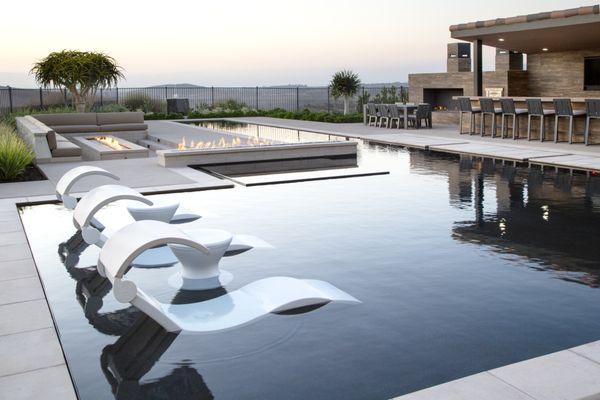 Geometric Pool with a tanning ledge, and built in sunloungers