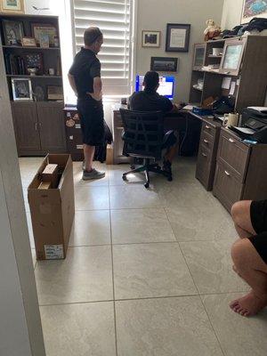 Techs working on our new computer