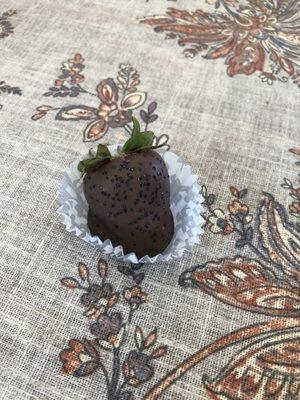 A chocolate covered strawberry.