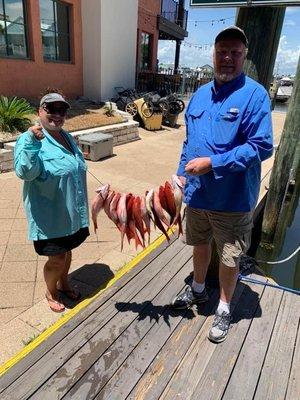 Wife and I with our fish haul.