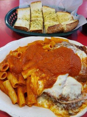 Chicken parm with rigatoni and garlic bread