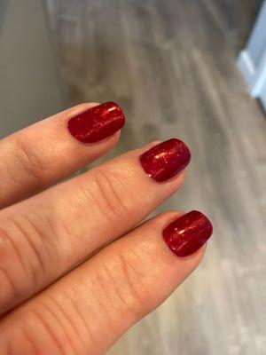 Sparkle red gel polish for the holidays $30 for the classic manicure. Color name is Good Gossip.