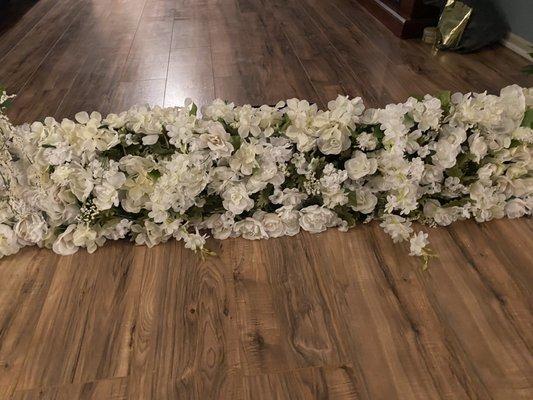 Flowers from Dollar Tree cut and trimmed and put on a styrofoam back board for the back drop of wedding ceremony.