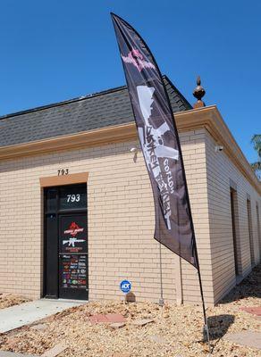 Corner of La Cadena & C St with our flag out.