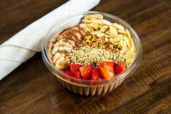 Cacao Base Granola, Banana, Strawberries Sliced Almonds, Chia Seeds Shaved Callebaut Chocolate