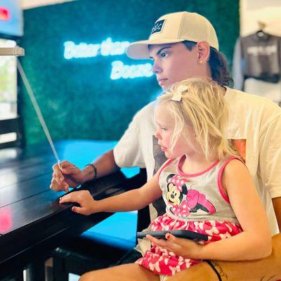 Reading the menu at Kava Culture Kava Bar on Marco Island.