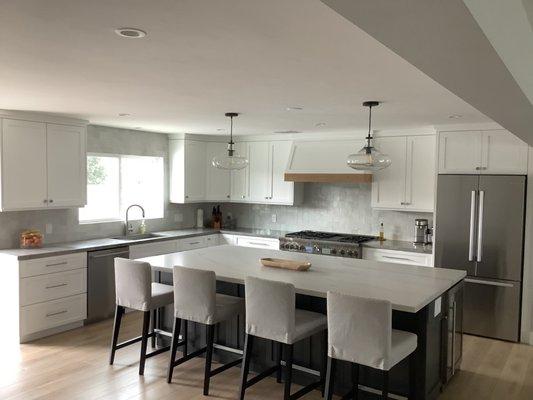 Kitchen. Removed wall where beam to the top right of the photo is. All new custom cabinetry.