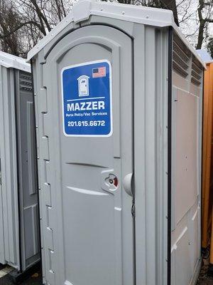 Mazzer Porta Potty/Vac Services standard portable toilet unit.