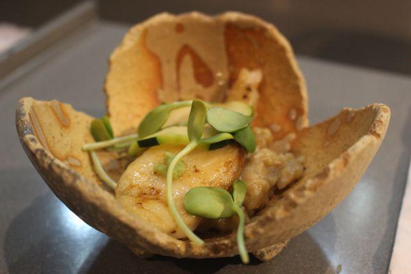 Black Cod, foie gras sauce rice, zucchini, sunflower sprout, and wasabi.