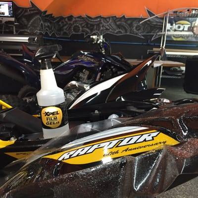 Yamaha raptor receiving Xpel ultimate Paint Protection Film.