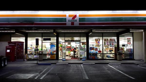 7 Eleven signage and entrance. Doors are wide open, how inviting!