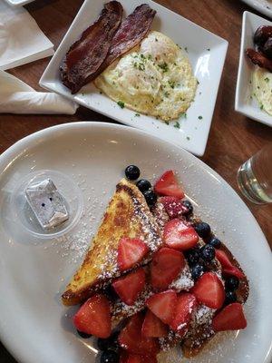 Waffles with berries and bacon/eggs on the side