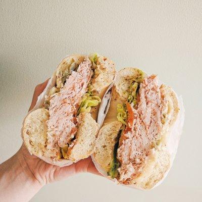 Pepper Mill Turkey (pepper turkey, jack cheese, jalapenos, lettuce, tomato and spicy mustard) on toasted sesame bagel