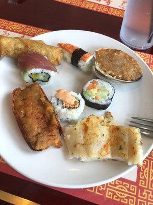 Sushi, salmon, egg roll and stuffed seafood