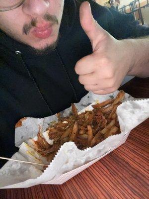 Enjoying my chili fries with mustard so good!