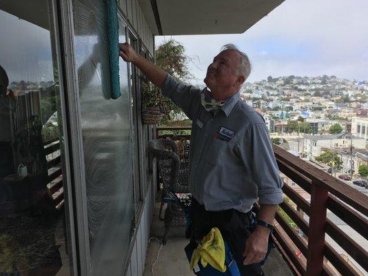 SpotFree cleaning window on apartment building.